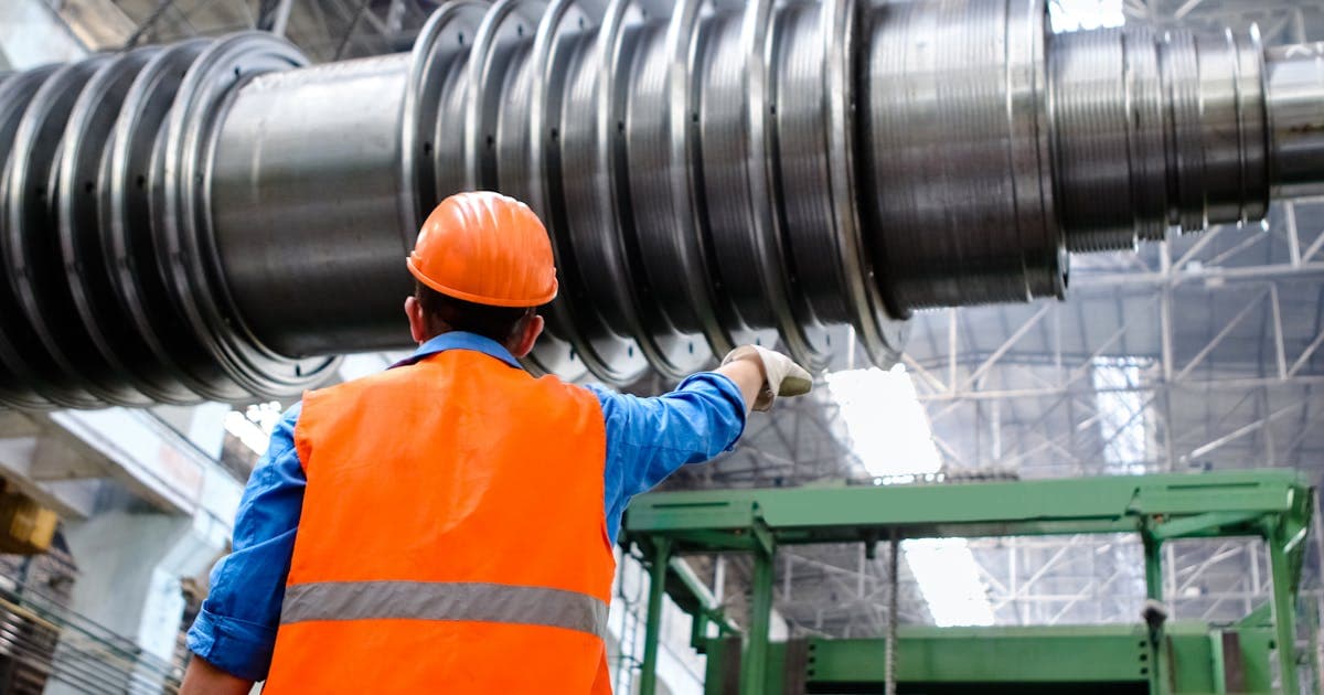 Technician inspecting an industrial evaporator